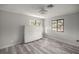 Cozy bedroom displays wood-look flooring and bright windows; mattress laying on the floor at 10245 Sw 105Th St, Ocala, FL 34481