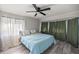 Bright bedroom with a queen-size bed and ample window light at 10245 Sw 105Th St, Ocala, FL 34481