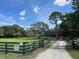 Private entrance with gate leading to a beautiful pasture and stunning property at 10245 Sw 105Th St, Ocala, FL 34481