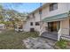 Back of house with a porch and screened enclosure at 10245 Sw 105Th St, Ocala, FL 34481