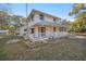 Two-story house with green roof and white porch at 10245 Sw 105Th St, Ocala, FL 34481