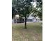 Exterior view showcasing the home's screened-in porch and backyard at 10245 Sw 105Th St, Ocala, FL 34481