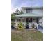 Charming home featuring a welcoming covered front porch and well-maintained landscaping at 10245 Sw 105Th St, Ocala, FL 34481