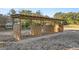 Outdoor horse shelter with three stalls, providing ample shade and protection at 10245 Sw 105Th St, Ocala, FL 34481
