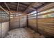 Empty interior of a wooden horse stall at 10245 Sw 105Th St, Ocala, FL 34481