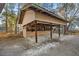 Two horse stalls with wooden walls and shelters at 10245 Sw 105Th St, Ocala, FL 34481