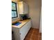 Functional kitchen with white cabinets, countertop appliances, and tiled floors at 10245 Sw 105Th St, Ocala, FL 34481