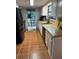 Bright kitchen offering a seamless transition to the outdoor view, white cabinets, and stainless appliances at 10245 Sw 105Th St, Ocala, FL 34481