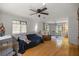 Bright living room featuring hardwood floors and a cozy seating area at 10245 Sw 105Th St, Ocala, FL 34481