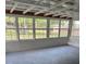 Enclosed sunroom featuring multiple windows providing a beautiful outdoor view at 10245 Sw 105Th St, Ocala, FL 34481