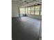 Sunroom with multiple windows and gray painted concrete floor at 10245 Sw 105Th St, Ocala, FL 34481