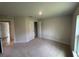 Cozy bedroom with carpet flooring, a closet, and a window with natural light at 10927 Sw 41St Ave, Ocala, FL 34476