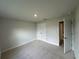 Spacious bedroom with neutral carpet, ample closet space, and a bright, airy feel at 10927 Sw 41St Ave, Ocala, FL 34476