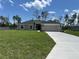 Charming single-story home with a well-manicured lawn and concrete driveway at 10927 Sw 41St Ave, Ocala, FL 34476