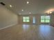 Spacious living room featuring tile floors, recessed lighting, and lots of natural light at 10927 Sw 41St Ave, Ocala, FL 34476