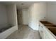 Main bathroom featuring tile flooring, shower, soaking tub, and vanity area at 10927 Sw 41St Ave, Ocala, FL 34476