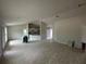 Open floor plan featuring the living room and kitchen, with tile flooring and lots of natural light at 10927 Sw 41St Ave, Ocala, FL 34476