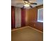 Spacious bedroom with carpeting, window, and ceiling fan at 10973 Sw 86Th Ct, Ocala, FL 34481