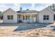 Charming new construction home featuring vertical siding, inviting front porch, and pristine curb appeal on a sunny day at 11910 Sw 43Rd Street Road, Ocala, FL 34481