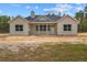 New construction with board and batten exterior, gray roof, and covered porch at 11910 Sw 43Rd Street Road, Ocala, FL 34481