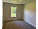 Bright bedroom with large window providing natural light and backyard view at 13 Nw 45Th Loop, Ocala, FL 34475