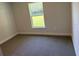 Cozy bedroom with a window offering views of the outdoors at 13 Nw 45Th Loop, Ocala, FL 34475
