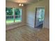 Open dining area with chandelier, connected to kitchen and offering backyard views at 13 Nw 45Th Loop, Ocala, FL 34475