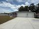 New construction home featuring an attached two car garage and a driveway in front at 13 Nw 45Th Loop, Ocala, FL 34475