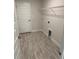Laundry room featuring wood-look tile flooring, a wire rack, and washer/dryer hookups at 13 Nw 45Th Loop, Ocala, FL 34475