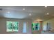 Bright living room with natural light, featuring views of the backyard and an open floorplan at 13 Nw 45Th Loop, Ocala, FL 34475