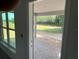 View from inside the house towards the covered patio overlooking the backyard space at 13 Nw 45Th Loop, Ocala, FL 34475