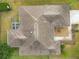 Top-down view of house showing roofline and landscaping at 1509 Hollyberry Pl, The Villages, FL 32162