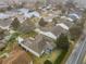 Aerial view of house and surrounding neighborhood at 1509 Hollyberry Pl, The Villages, FL 32162