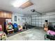 Spacious garage with overhead storage and ample space at 1509 Hollyberry Pl, The Villages, FL 32162