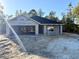 New construction home, block exterior walls, and a dark-colored roof at 15128 Se 93Rd Ave, Summerfield, FL 34491