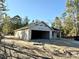 New construction home, block exterior walls, and a dark-colored roof at 15128 Se 93Rd Ave, Summerfield, FL 34491