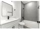 Modern bathroom with gray tile and a bathtub at 15413 Sw 65Th Terrace Rd, Ocala, FL 34473