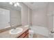 Clean bathroom with tub, toilet, and vanity at 16360 Se 88Th Ct, Summerfield, FL 34491