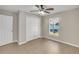 Spacious bedroom with large closet and vinyl flooring at 16360 Se 88Th Ct, Summerfield, FL 34491