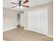 Bright bedroom with double door closet and vinyl flooring at 16360 Se 88Th Ct, Summerfield, FL 34491