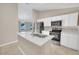 Modern kitchen with white cabinets, stainless steel appliances, and an island at 16360 Se 88Th Ct, Summerfield, FL 34491