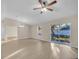 Bright living room with vinyl flooring and sliding glass doors to backyard at 16360 Se 88Th Ct, Summerfield, FL 34491