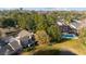 Aerial view of community with pool and pond at 1795 Se Clatter Bridge Rd # 1795, Ocala, FL 34471