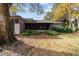 Screened porch and mature landscaping in the backyard at 1795 Se Clatter Bridge Rd # 1795, Ocala, FL 34471