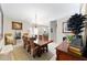 Elegant dining room featuring a wood table, chandelier, and hardwood floors at 1795 Se Clatter Bridge Rd # 1795, Ocala, FL 34471