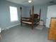 Spacious bedroom with a large wooden post bed at 23092 Sw Nautilus Blvd, Dunnellon, FL 34431