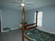 Bedroom with a wooden post bed and ceiling fan at 23092 Sw Nautilus Blvd, Dunnellon, FL 34431