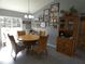 Charming dining area with wood table and wicker chairs at 23092 Sw Nautilus Blvd, Dunnellon, FL 34431