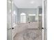 Spa-like bathroom with double vanity, soaking tub, and walk-in shower at 2330 Nw 59Th Ave, Ocala, FL 34482