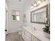 Clean bathroom boasts a vanity with a large mirror and updated fixtures at 2330 Nw 59Th Ave, Ocala, FL 34482